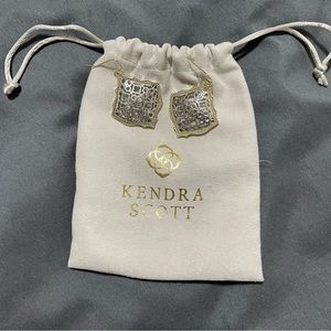 Kendra Scott Good and Silver mixed metal earrings. Kendra logo reaping in center